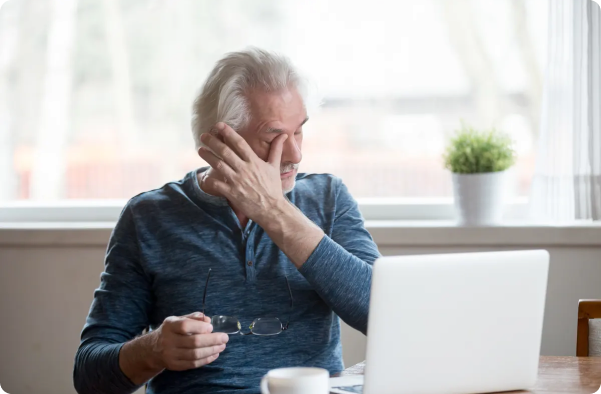 Person managing dry eye symptoms while using a computer